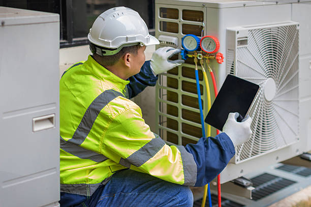 Professional Air Duct Cleaning technician working in South Lancaster, MA